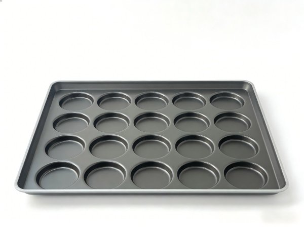 Quality Assurance for Commercial Baking Pans A quality control inspector examining a commercial baking pan