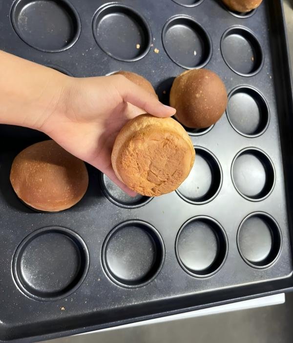 A close-up view comparing the textures of a bread pan coating and a cake pan coating